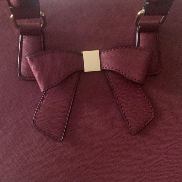 Gently used burgundy colored handbag with gold accents - Picture 3 of 6